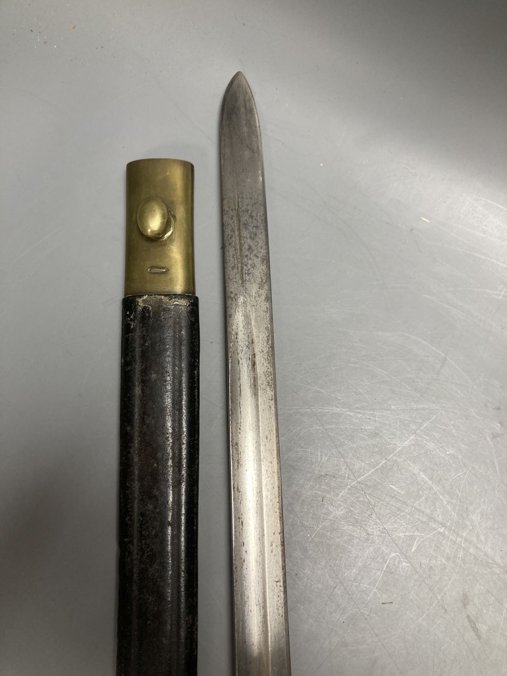 An Italian Torre Annunziata bayonet, 51cm blade, within leather and brass scabbard